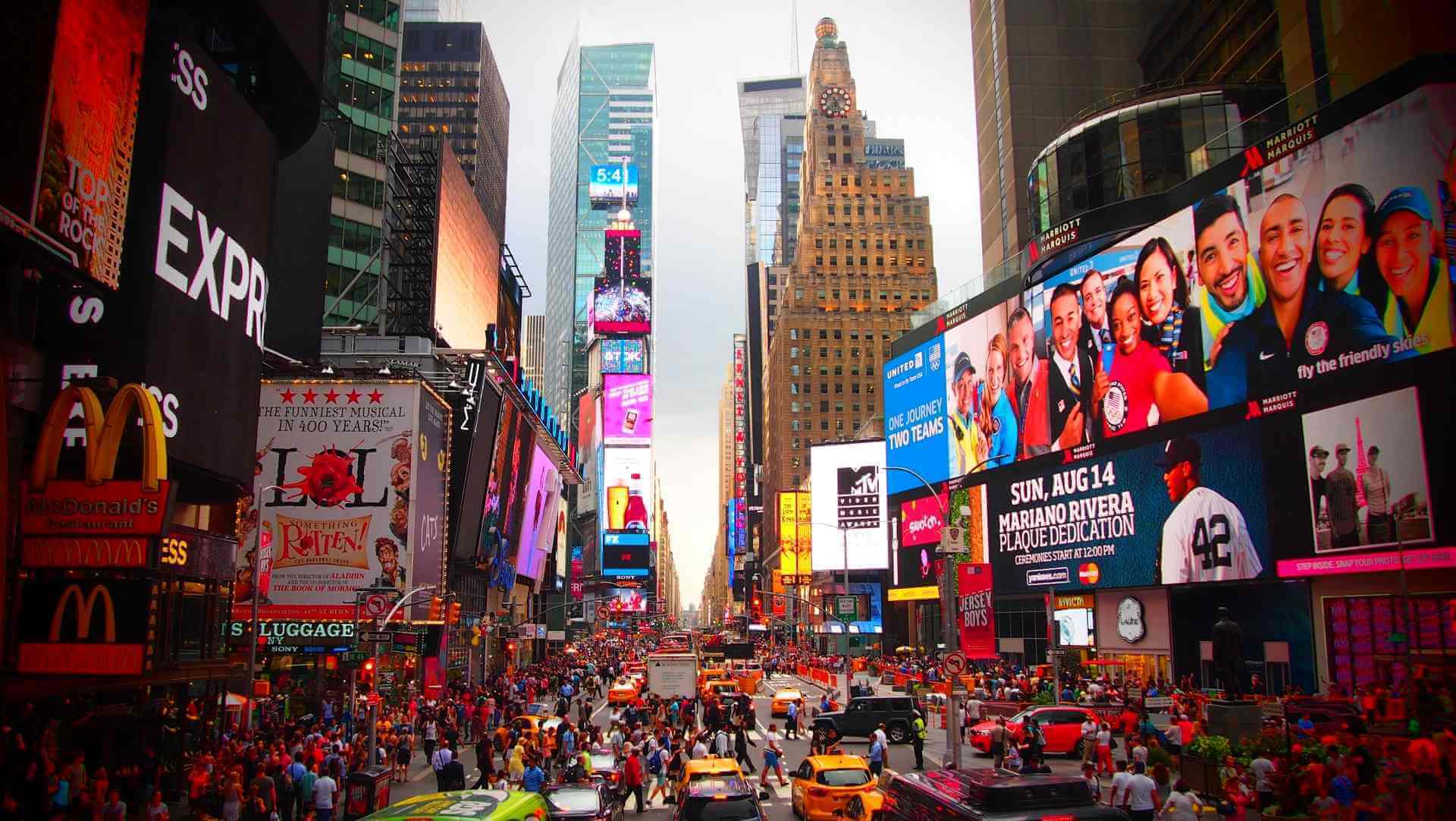 default-img Vibrant Times Square scene with billboards, crowds, and taxis in New York City.